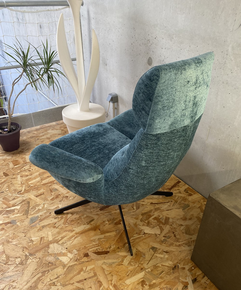 Blue velvet wivel armchair