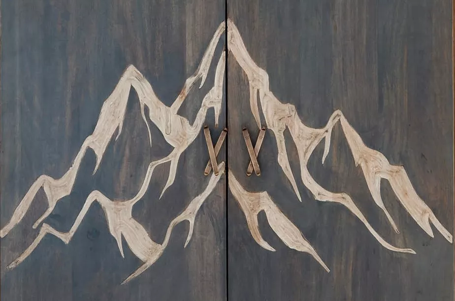 Mountain motif storage cabinet